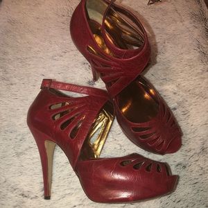 Cherry, onyx leather open toe pumps.